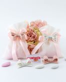 Magnete fiocco a pois bianco e rosa assortito su sacchetto